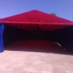 Namiot czerwony z szynami i rolkami